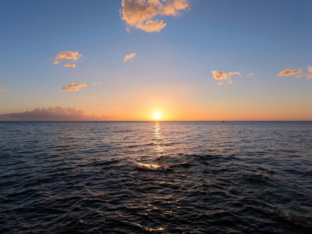 calm sunrise over an ocean, representing inner peace when being misunderstood as a Christian
